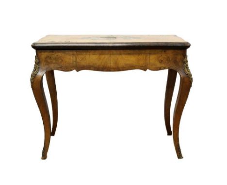 Victorian walnut and inlaid card table, serpentine outline with tooled leather playing surface, on gilt metal mounted cabriol