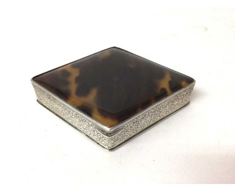 White metal compact mirror, of lozenge form, with chased decoration and tortoiseshell top and cover and base, 9cm wideProvena