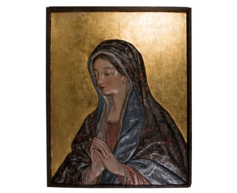 "Praying Virgin Mary". Polychromed wooden relief. Granada School. First quarter of the 18th century.  Measurements: 72 x 57 c