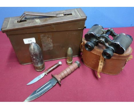 5.56 ammunition tin, cased pair of binoculars, a small sheath knife, an american style combat knife, a trench art lighter, an