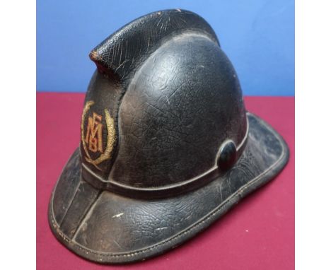 Leather covered fireman's helmet, the front marked FMB within laurel, the inside complete with leather liner and chinstrap st