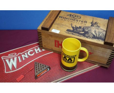 Selection of Winchester related items including three rubberised mats, a Big Shot mug, Winchester bullet head display stand a