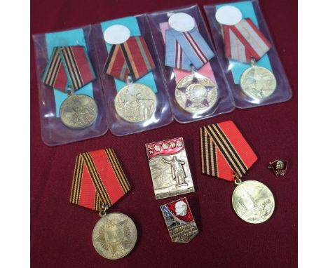 Group of six Soviet Russian medals and three Russian badges including USSR Medal Celebrating 60 Years Of The Soviet Army, sim