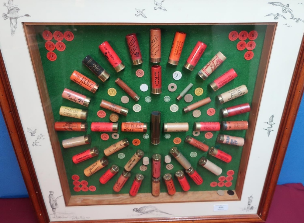 Framed & mounted shotgun cartridge display containing various vintage