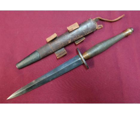 Fairbairn Sykes second patent commando knife with sheath, with brass grip, the crosspiece and blackened blade the crosspiece 