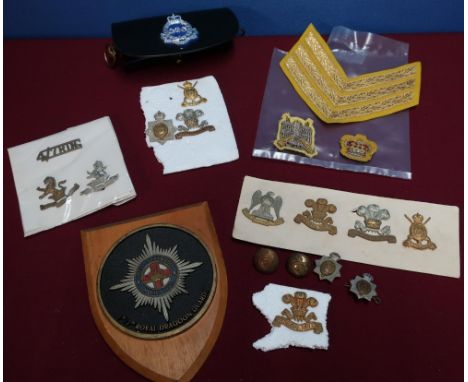Selection of British Army regimental cap badges for various Dragoon Guard regiments including the 3rd Dragoons, 7th Dragoons,