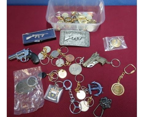 Collection of various keyrings, machine gun belt buckles, lighter etc 