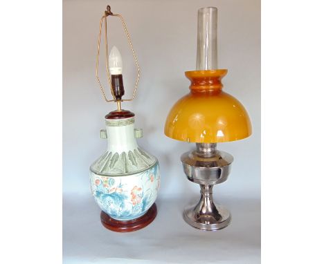 An Aladdin number 21 chrome oil lamp with orange shade together with a further Chinese porcelain table lamp (2)