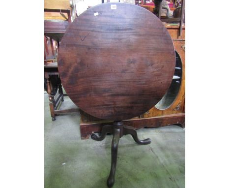 A Georgian mahogany snap top occasional table, the circular one piece top (80 cm in diameter approx) with bird cage action ra