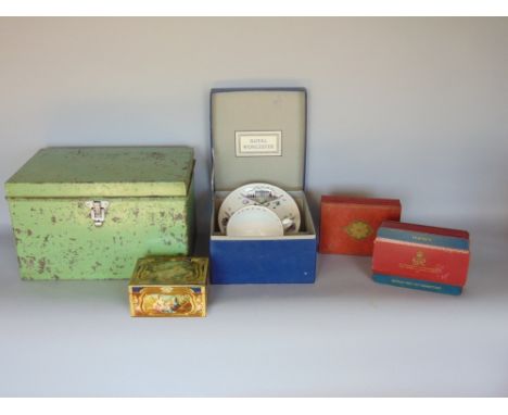A mixed lot to include a collection of vintage tins, a cased Royal Worcester mug and saucer set and further metal trunk fille