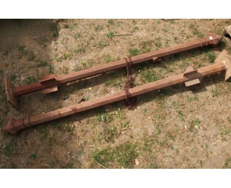 A pair of Victorian cast iron gate posts of octagonal form with domed finials, 215 cm in height approx