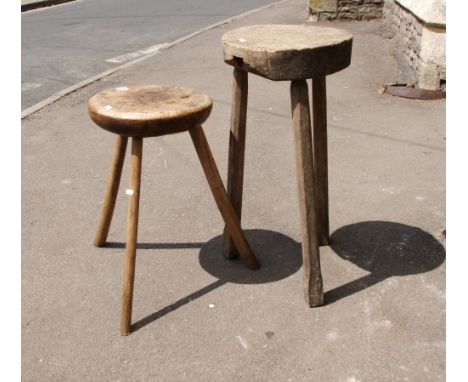 Two primitive stools in elm with rustic stick like bases