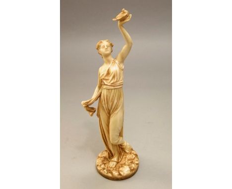 A Royal Worcester figure with ivory glaze and gilt detail of a classical female character with outstretched arm and bird in p