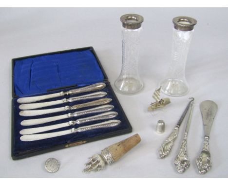 A mixed collection of silver to include a cased set of silver handled fruit knives, three silver handled boot tools, a silver