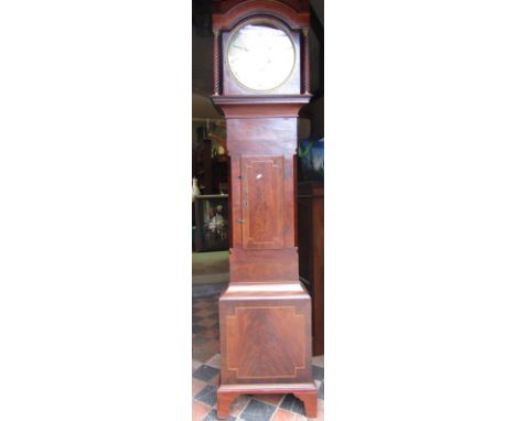 A Regency mahogany Scottish longcase clock, the trunk with inlaid detail, arched hood with spiral column enclosing 33 cm whit