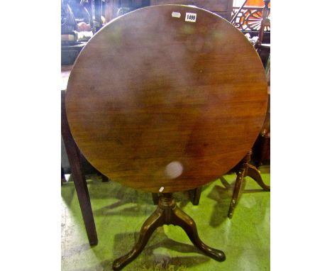 A Georgian mahogany snap top table, the circular top raised on a vase shaped pillar and tripod base, 68 cm diameter