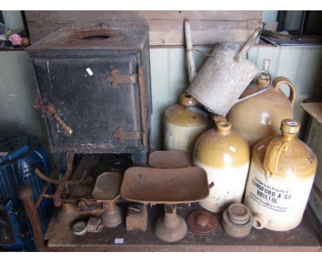 One lot of miscellaneous items to include five stoneware flagons of varying capacity, a vintage tin warming oven, various cas