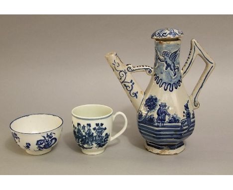 A 19th century continental tin glazed earthenware coffee pot and cover with blue and white painted angel, figures beneath a t