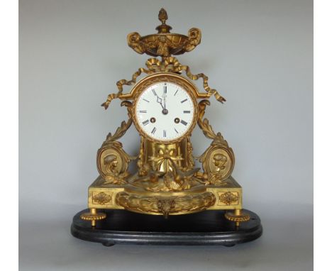 A two train French drumhead mantle clock, with fancy gilt spelter case, fitted with birds, oval portraits, twin handled compa