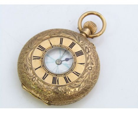 18ct half hunter fob watch, the exterior case with blue enamel Roman numerals and engraved scrolled foliage, 34 grams gross 