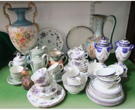 A collection of Poole Pottery green ground coffee wares comprising coffee pot, hot water jug, sugar bowl, three cups and four