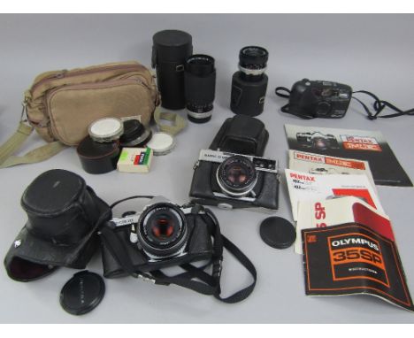 A box containing a collection of vintage Pentax and Olympic cameras and accessories 