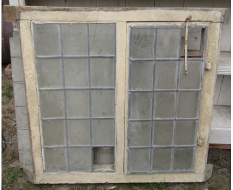 A reclaimed antique oak framed window enclosing two leaded light panels (one opening), together with a small ledge and braced