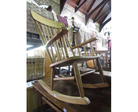 Two beechwood rocking chairs of varying design, one with stick back