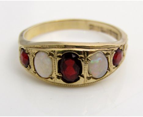 A 9ct almandine garnet and opal ring, size R, 3g