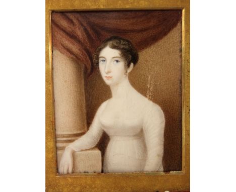 A 19th century school - half length portrait of a standing lady by a Corinthian column, miniature work on ivory, gilt mount a