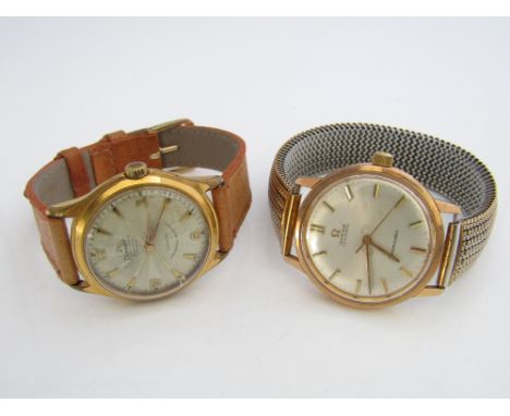 A 1950s Omega Seamaster automatic, the champagne dial with gilt baton markers, upon a concertina strap; together with a furth