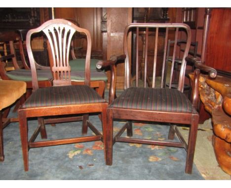 A Georgian mahogany open elbow chair with moulded stick back, shaped and scrolled arms over a generous drop in upholstered se