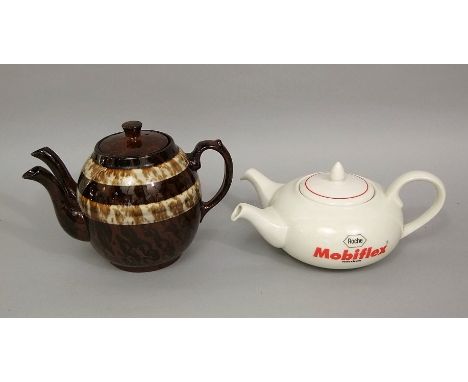 An unusual double spouted teapot with mottled brown glaze, 18cm tall, together with a further double spouted teapot advertisi