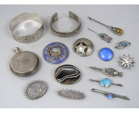 A collection of silver and white metal jewellery to include a perfume bottle, starburst paste set brooch, sterling engine tur