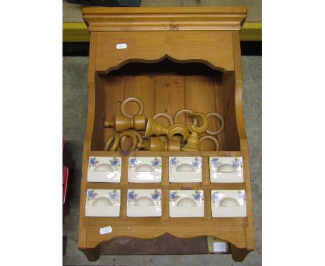 A small stripped pine kitchen hanging wall shelf incorporating eight small ceramic spice drawers, Optima picnic basket, brass