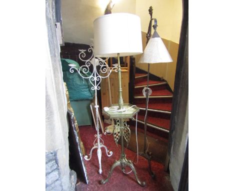 A good quality telescopic brass standard lamp, the stem with central onyx panelled tray with cast baluster gallery, lattice d