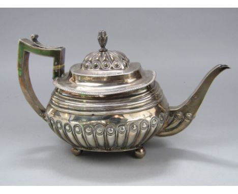 George III silver boat shaped teapot with half fluted decoration, maker Thomas Wallis, London 1810, 30 cm long, 20 oz approx