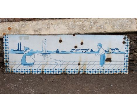 A vintage enamel panel of rectangular form with Dutch figure and landscape scene, 122cm x 38cm approx