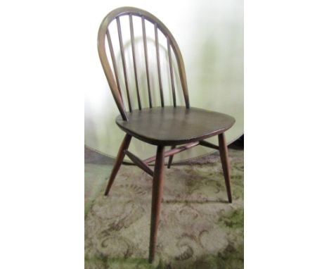 A set of five (3+2) Ercol dark stained elm and beechwood stick back dining chairs