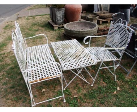 A contemporary steel framed two seat garden bench with lattice strap work seat and twin panelled back beneath a simple scroll