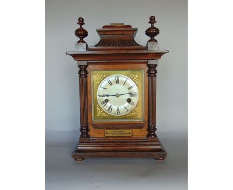 A continental oak cased two train mantle clock, the gilt brass dial signed TP Wright of Holloway Road, in an architectural ca