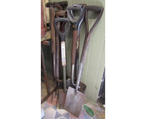A small collection of vintage and contemporary long handled gardening tools (spades and forks)