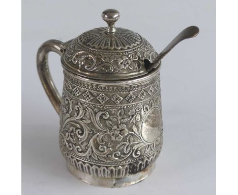 A Victorian silver lidded mustard, in the form of a baluster tankard with single handle and ball finial to cover, all-over pr