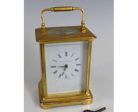 Matthew Norman - a lacquered brass carriage clock, having a signed white enamel Roman dial, visible platform escapement, twin