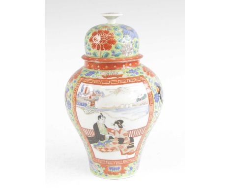 A Japanese porcelain jar and cover, Meiji period, of inverse baluster form, enamel decorated with panels of figures, red enam