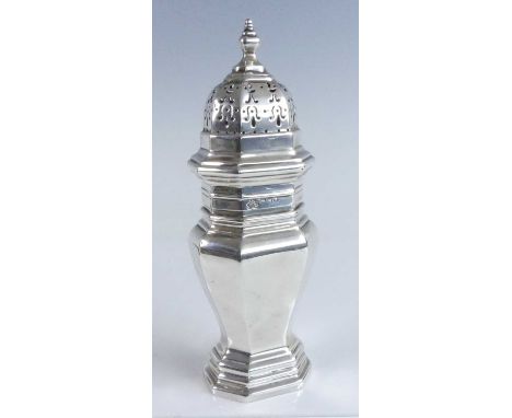 A George V silver sugar sifter, of octagonal baluster form to a stepped footrim, the removable cover having typical pierced s