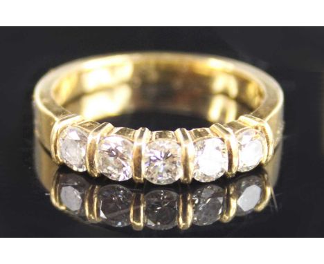 An 18ct yellow gold diamond half eternity ring, comprising five round brilliant cut diamonds in bar settings, diamond dimensi