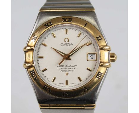An Omega Constellation chronometer bi-metal automatic wristwatch, having a round cream baton dial with date at three and yell
