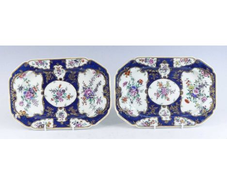 A pair of first period Worcester porcelain serving dishes, circa 1770, each decorated with cartouches of flowers upon a blue 