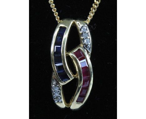 A modern 9ct gold, sapphire, ruby and diamond pendant, comprising six 2mm channel set calibre cut sapphires and six 2mm chann
